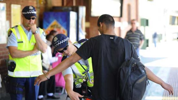 Police conduct weapons searches at Footscray station last November.