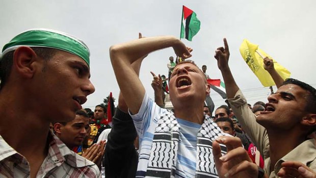Palestinians celebrate the reconciliation agreement between rival Palestinian factions Fatah and Hamas.
