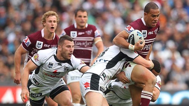 Manly's Will Hopoate fails to beat this tackle.