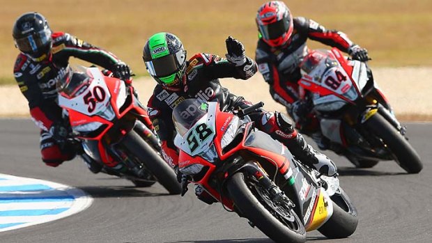 Lap record: Aprilia's Eugene Laverty waves to the crowd after his win.