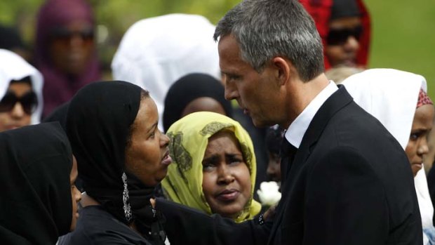 Grieving ... Norway's Prime Minister, Jens Stoltenberg, comforts a relative at the funeral of a woman killed by Breivik.