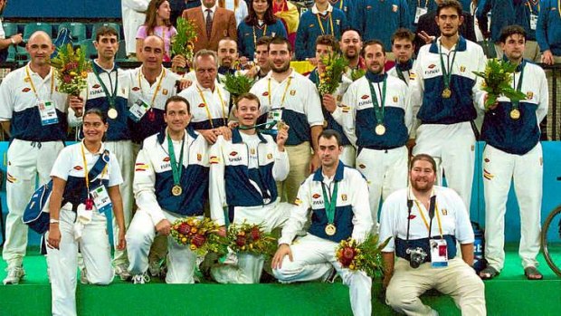 he Spanish Paralympic basketball team pose on the podium with their gold medals in Sydney.