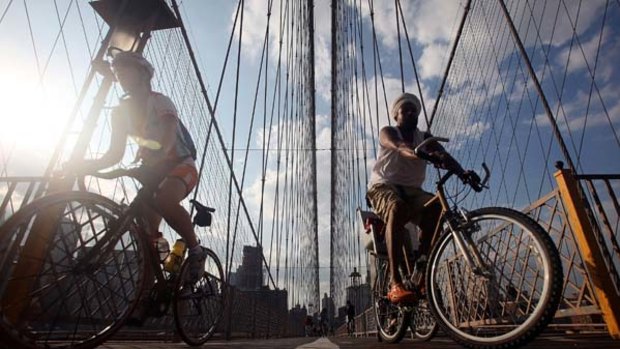 Pumped up ... evening commuters on Brooklyn Bridge.