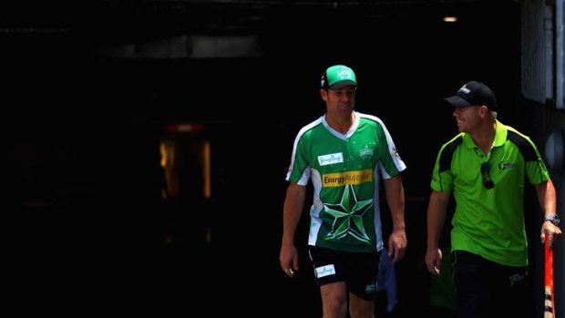 Green alert: Shane Warne of the Melbourne Stars (left) and Sydney Thunder's David Warner arrive for a Big Bash League media session at the Melbourne Cricket Ground.