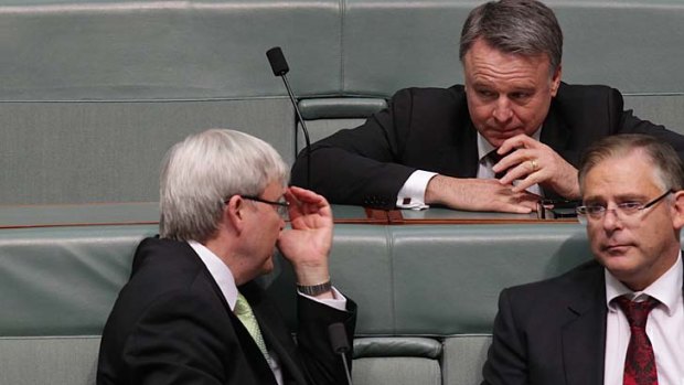 Resigned: Kevin Rudd and Joel Fitzgibbon discuss a point during Question Time.