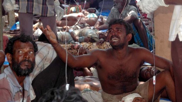 Cry for help: Wounded Tamils in a makeshift hospital in Vanni in 2009. There have been calls for Australia to cancel its tour of Sri Lanka.