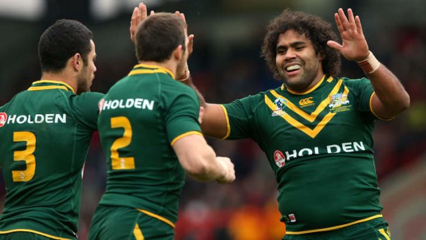 Slamming Sam: Kangaroo Sam Thaiday celebrates a try during Australia's World Cup quarter-final win over the US last week.