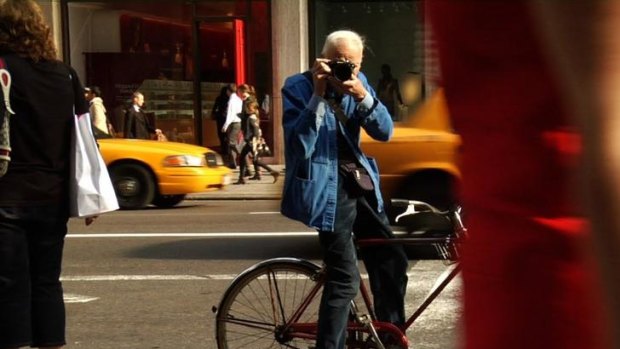 Who me? ... an enduring genius in the fashion world, Bill Cunningham, gets on his bike for a photo finish.