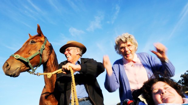 "My cup's three-quarters full": Les McLeod, of Stawell, trains the horses, his wife Judy (right) selects their bets, and his mother Lorna, 82, goes to the betting ring and places the money.