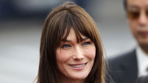 Carla Bruni-Sarkozy ... wants to show the world that she looks out for her husband’s interests.