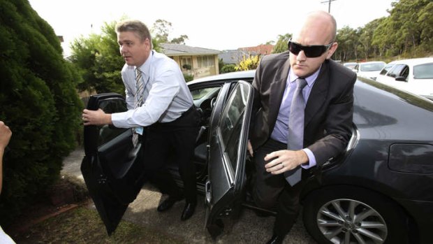 Detectives arrive to drag Roger Rogerson from his Padstow Heights home.