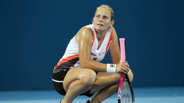 Flattened ... Jelena Dokic pauses for breath during her straight-sets loss in Brisbane yesterday.