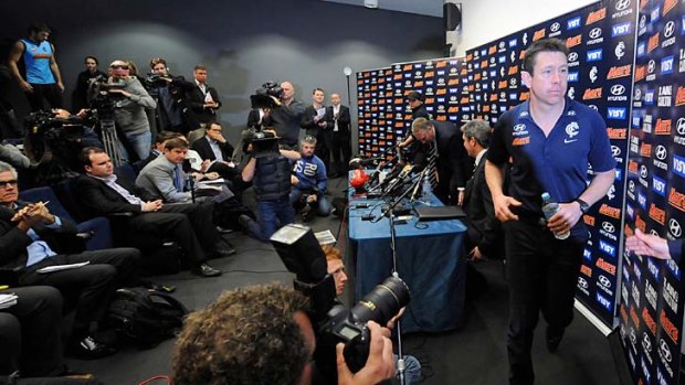 Carlton coach Brett Ratten leaves the press conference announcing his departure.