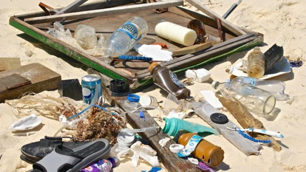 Doug Flockhart has found objects such as bottles, thongs, car tyres and card tables on visits to Moreton Bay.