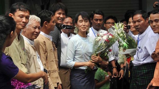 Burmese democracy icon Aung San Suu Kyi arrives at the opening ceremony of a library in Rangoon last month.