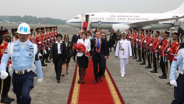 Prime Minister Tony Abbott and his wife Margie Abbott arrive in Jakarta.