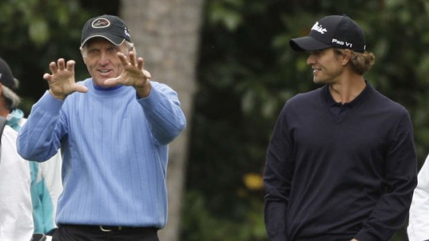 Master and apprentice: Norman with Adam Scott at Augusta in 2009.