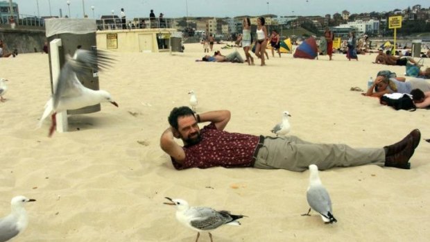 Bird man: Author Tim Low on Bondi Beach. 
