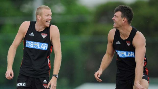 Laughing matter: Essendon's Dustin Fletcher (left) and David Hille. The Bombers say Hille has put in a great pre-season.