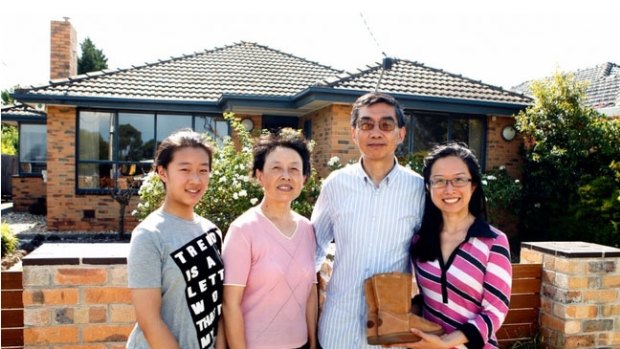 The Wang family with Gillard's ugg boots.