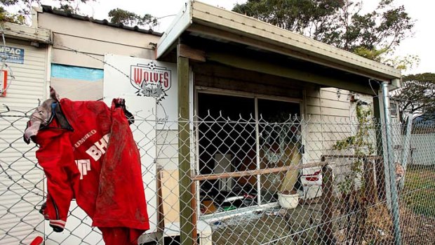 Hard times ... the abandoned demountable building at Lysaghts Oval still features the Wolves badge.