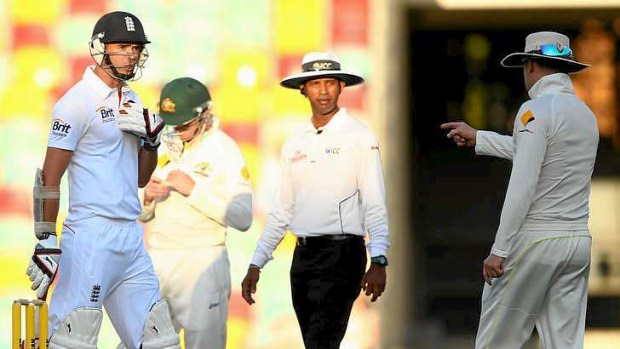 Part of the game: Australian captain Michael Clarke clashes with James Anderson of England.