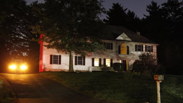 A police car sits in the driveway of the Massachusetts home of 26-year-old Rezwan Ferdaus, who has been arrested and accused of plotting to destroy the Pentagon and the US Capitol with explosive remote-controlled aircraft.