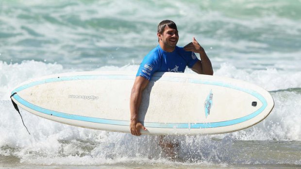 Drew Mitchell  runs out of the water during the Surf Pro-Am at Manly Beach on Saturday.