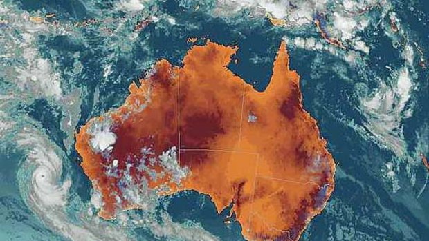 A satellite image shows cyclones threatenening both east and west coasts of Australia at 9.30pm Friday.