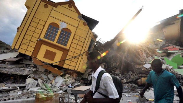 People among the ruins of earthquake devastated Port-au-Prince.