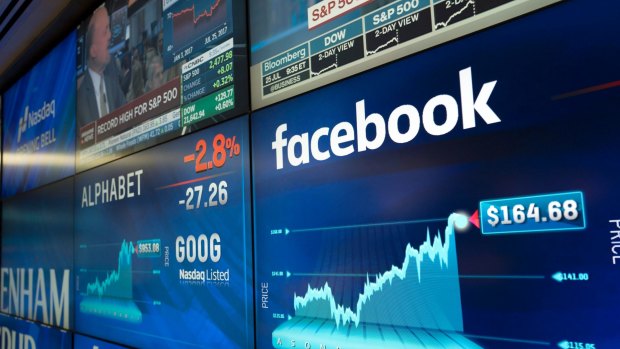 Facebook stock values are shown on a screen at the Nasdaq MarketSite.