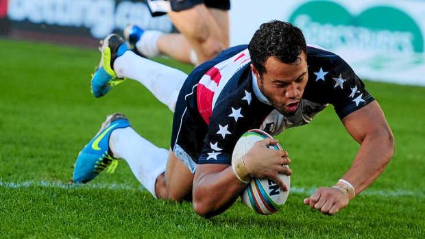 Stars and stripes: USA's Joseph Paulo dives over to score in the Tomahawks' upset defeat of hosts Wales at the Rugby League World Cup.