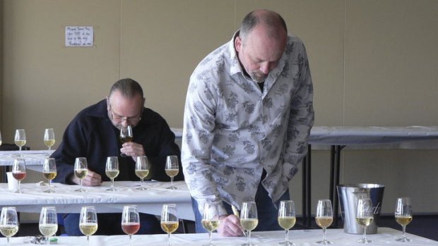 Judges Willie Simpson and Neal Cameron making sense of a very competitive cider class.
