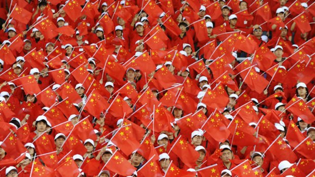 Seeing red: A rehearsal this week of celebrations to commemorate the 60th anniversary of the founding of the People?s Republic of China, at a stadium in Shenyang.