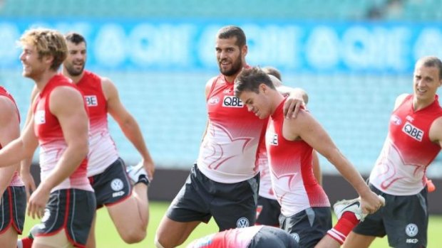 Sydney Swans forward Buddy Franklin warms up with his teammates at training on Thursday.
