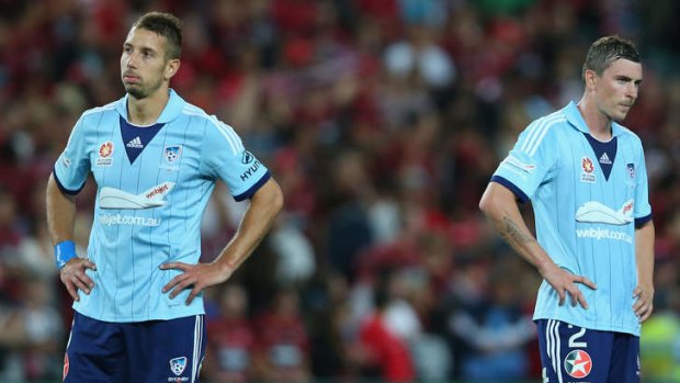 Dejected: Nikola Petkovic and Seb Ryall after Sydney FC's loss on Saturday night.