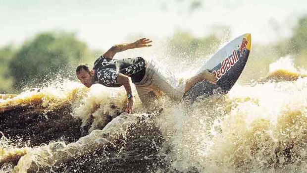 Brazilian Picuruta Salazar surfs a wave on the Amazon River in Amapa in northeastern Brazil in 2003, riding the longest wave on earth.