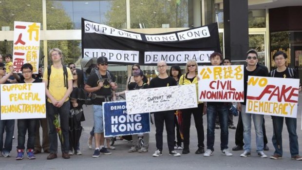 UNITED WE STAND: International students and other supporters of pro-democracy protesters in Hong Kong make their views heard outside the Chinese embassy on Monday.