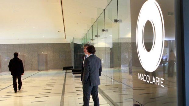 Macquarie Group cuts its profit outlook.