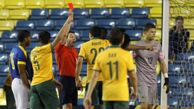 Turning point: Australia's goalkeeper Mitch Langerak (R) is sent off during the friendly.