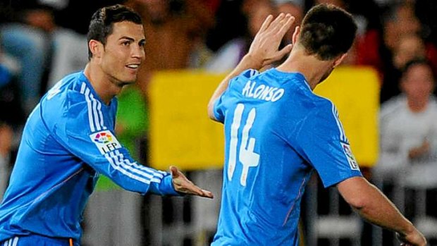 Hot streak: Cristiano Ronaldo (left) celebrates with Xabi Alonso after scoring against Almeria.