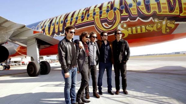Powderfinger with the Jetstar plane specially painted for their final tour.