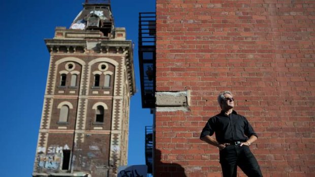 Artist Robert Clinch outside the Yorkshire brewery building in Collingwood, depicted in his painting <i>Fanfare for the Common Man</i>.