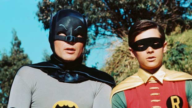 Adam West as Batman with Robin in the old 1960s television series.