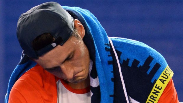 Case for defence: John Newcombe, Mark Woodforde and Jason Stoltenberg have spoken out in favour of Bernard Tomic after the 21-year-old Australian retired hurt on Monday.
