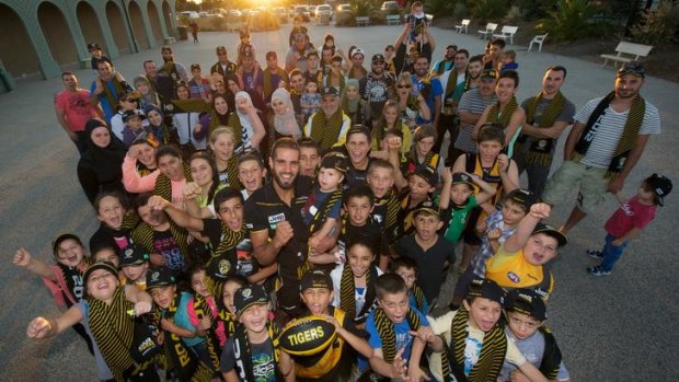 Richmond's Bachar Houli, seen here with members of his family, has alerted the AFL to the need for prayer rooms at league grounds.