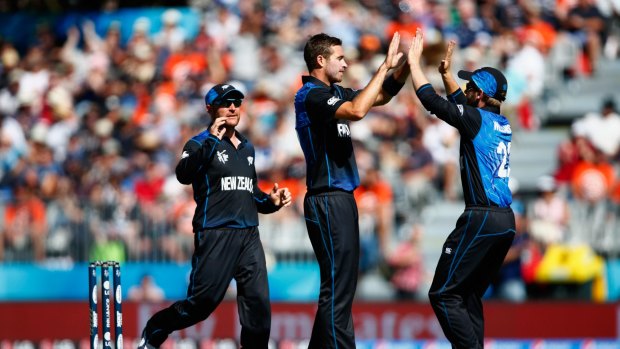 Too easy: Tim Southee and the Black Caps had plenty of cause for celebration after dismissing the Scotland team for 142 at University Oval in Dunedin. 
