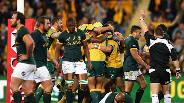 Try time: Wallabies veteran Adam Ashley-Cooper celebrates scoring.