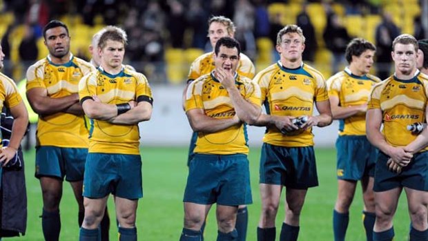 Wallabies captain George Smith (C) looks dejected following his teams loss in the 2009 Tri Nations series Bledisloe Cup match in Wellington.