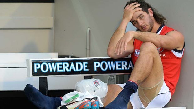 Adelaide's Taylor Walker contemplates a season on the sidelines after injuring his knee against Carlton.